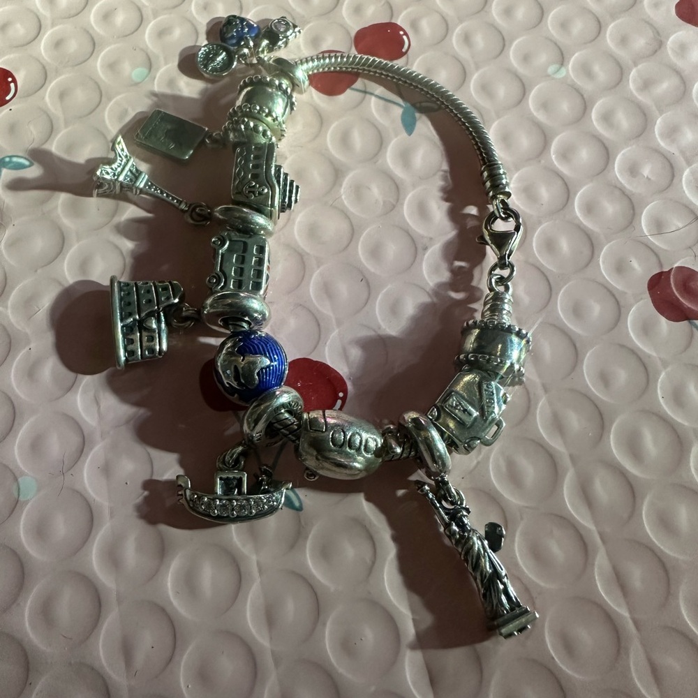 authentic Pandora Travelers charm bracelet. It’s a must have if u travel a-lot. - Picture 3 of 9